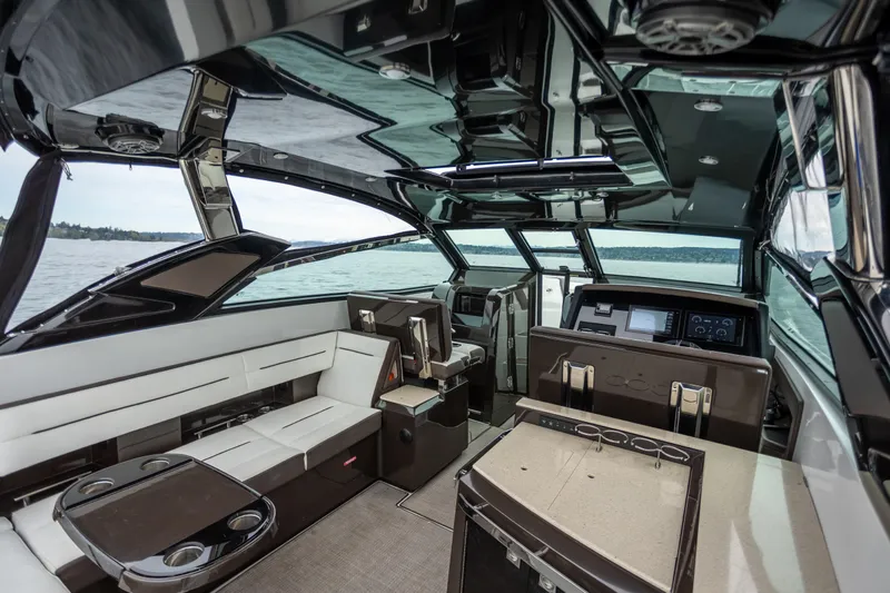 Slide: The Image of Luxurious interior of a 2019 Cobalt A36 boat with modern seating and dashboard. - 17