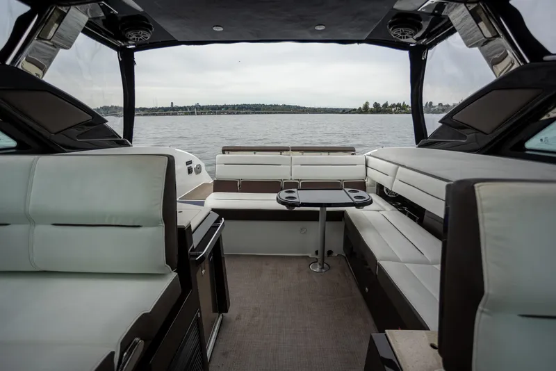 Slide: The Image of Interior of a 2019 Cobalt A36 boat with luxurious seating and lake view. - 18