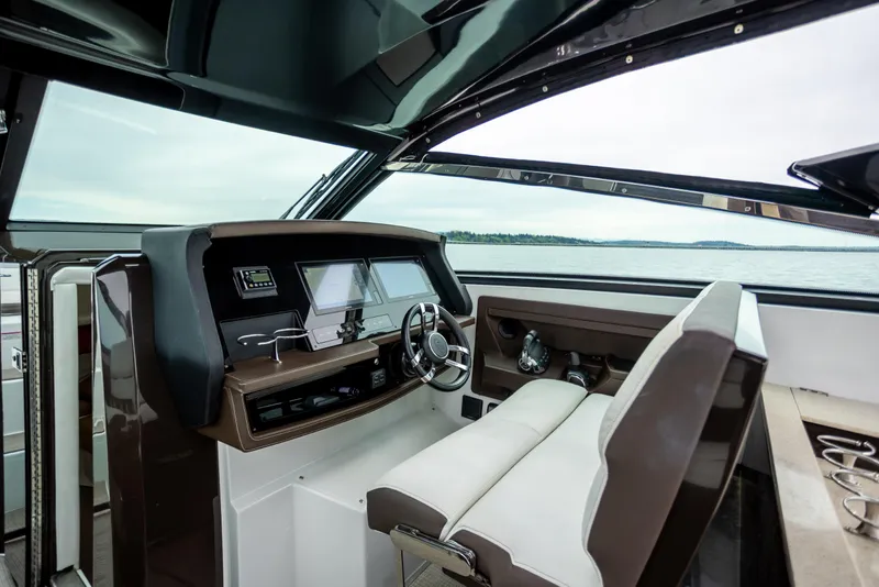 Slide: The Image of Interior of 2019 Cobalt A36 boat cockpit with modern controls and seating. - 20