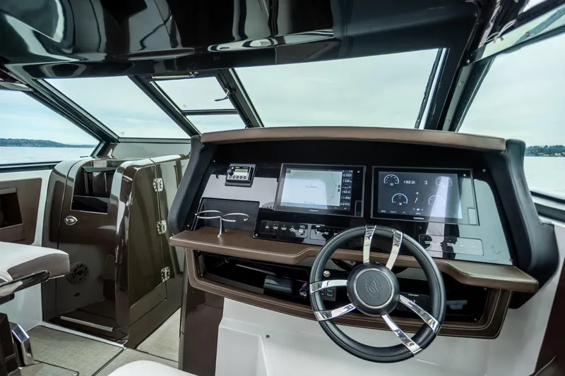 Slide: The Image of Interior cockpit of 2019 Cobalt A36 boat with modern navigation displays. - 21