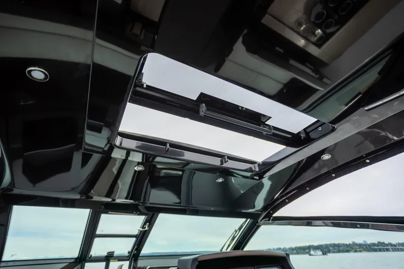 Slide: The Image of 2019 Cobalt A36 yacht interior with open sunroof, showcasing sleek design and modern features. - 23