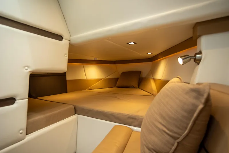 Slide: The Image of Luxurious interior cabin of 2019 Cobalt A36 boat with cozy bedding and ambient lighting. - 26