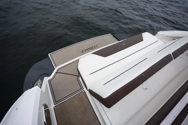 Slide: The Image of 2019 Cobalt A36 boat deck with cushioned seating and water view. - 7