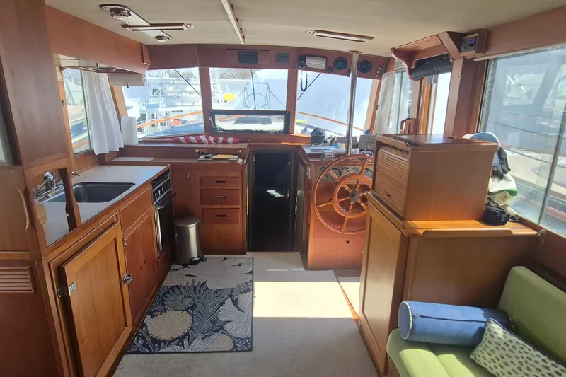 Slide: The Image of Interior of 1983 Grand Banks 42 Motoryacht with wooden cabinetry and helm station. - 10