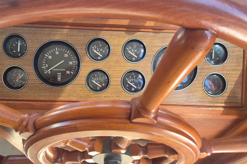 Slide: The Image of Cozy bedroom interior of 1983 Grand Banks 42 Motoryacht with wooden paneling and nautical decor. - 13