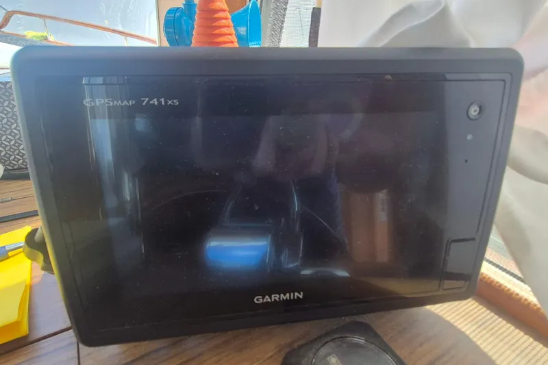 Slide: The Image of Wooden helm and gauges of 1983 Grand Banks 42 Motoryacht. - 14