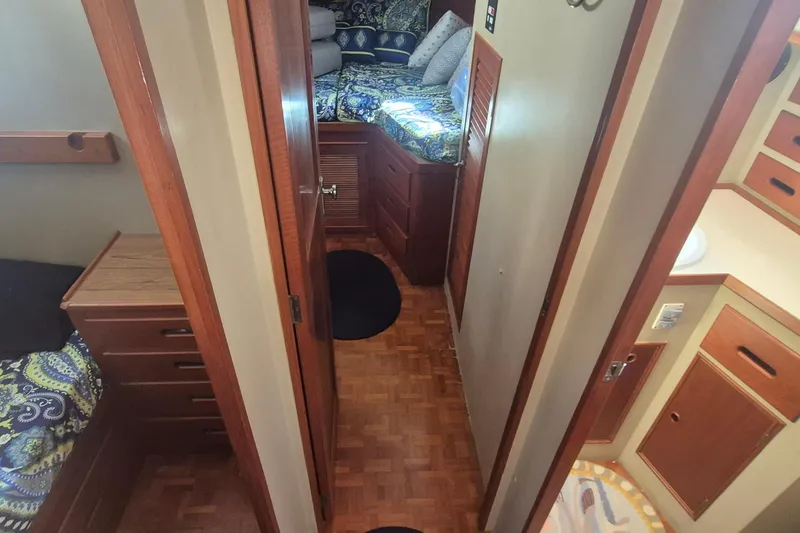 Slide: The Image of 1983 Grand Banks 42 Motoryacht kitchen with electric stove and wooden cabinetry. - 16