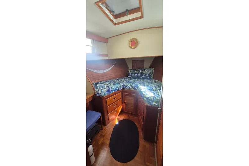 Slide: The Image of Bathroom interior of 1983 Grand Banks 42 Motoryacht with wooden cabinetry and nautical decor. - 19
