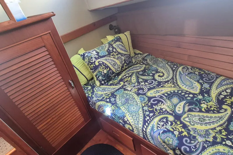 Slide: The Image of 1983 Grand Banks 42 Motoryacht interior with cozy bedroom and compact bathroom. - 21