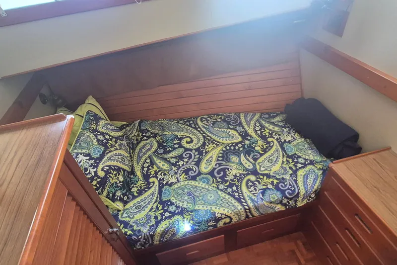 Slide: The Image of Cozy cabin bed with paisley bedding in 1983 Grand Banks 42 Motoryacht. - 22