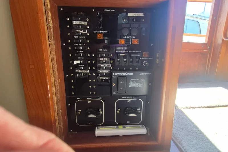 Slide: The Image of Interior of 1983 Grand Banks 42 Motoryacht with cozy cabin and patterned bedding. - 24