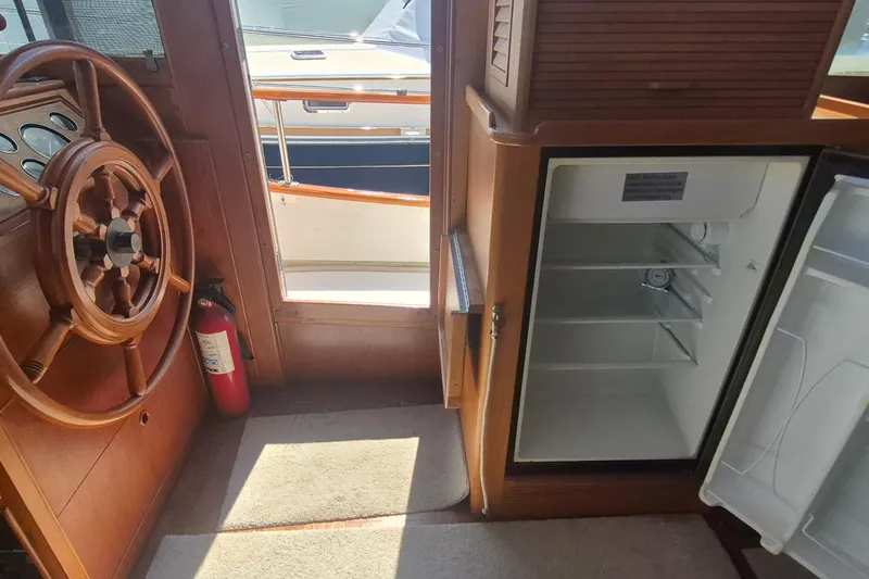 Slide: The Image of Control panel of a 1983 Grand Banks 42 Motoryacht with various switches and dials. - 27
