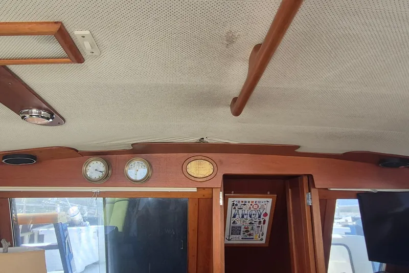 Slide: The Image of Interior of 1983 Grand Banks 42 Motoryacht with wooden cabinetry and "Wanderer" mat. - 29