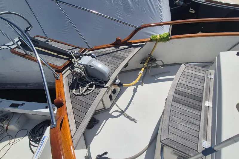 Slide: The Image of 1983 Grand Banks 42 Motoryacht docked, showcasing spacious deck and classic design. - 33