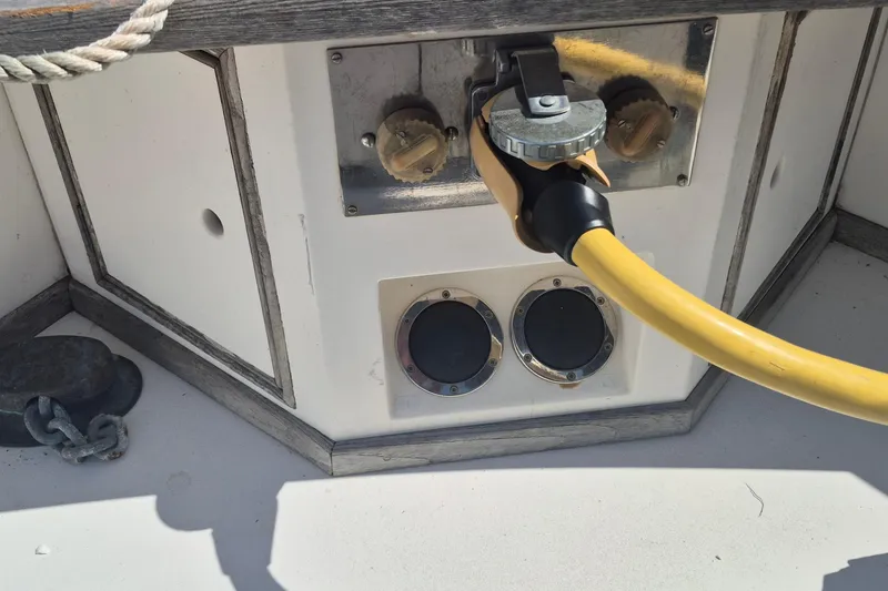 Slide: The Image of Close-up of 1983 Grand Banks 42 Motoryacht's metal and wood railing detail. - 36