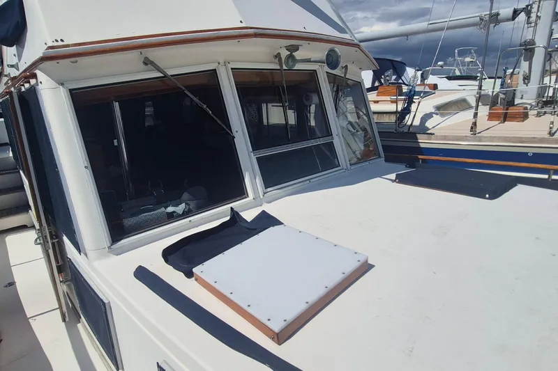 Slide: The Image of 1983 Grand Banks 42 Motoryacht power connection with yellow cable and metal fittings. - 37