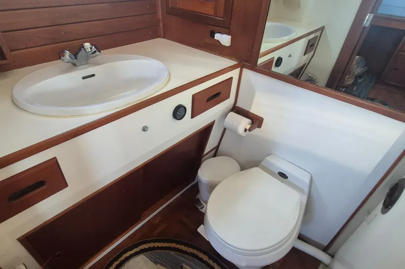 Slide: The Image of Bathroom interior of 1983 Grand Banks 42 Motoryacht with sink and toilet. - 4