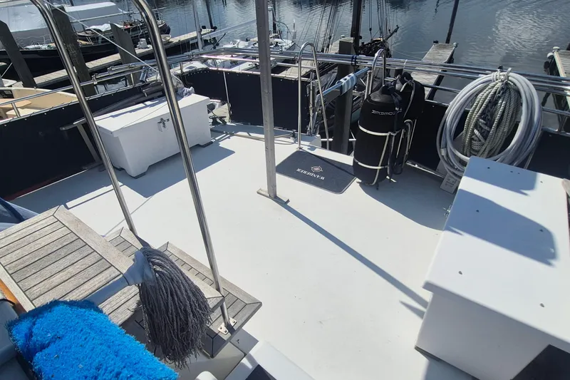 Slide: The Image of 1983 Grand Banks 42 Motoryacht exterior with wooden accents and logo detail. - 41