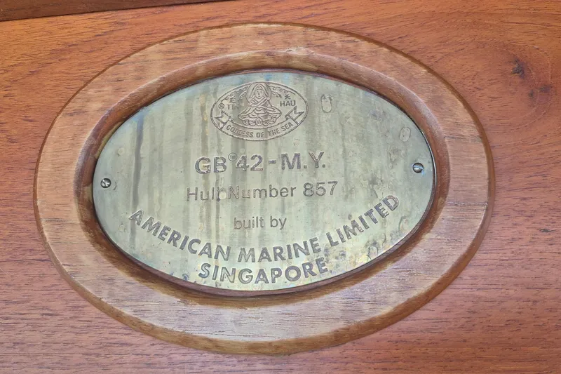 Slide: The Image of Deck of 1983 Grand Banks 42 Motoryacht with nautical equipment and dock view. - 42