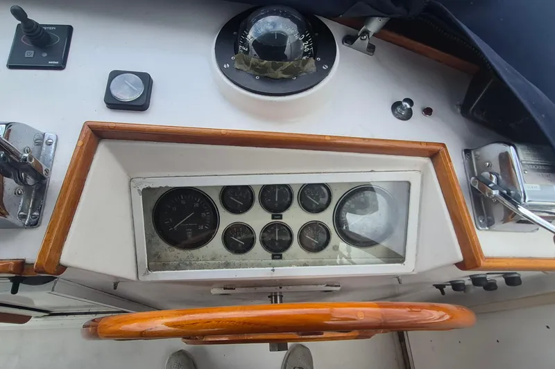 Slide: The Image of Compass and gauge on 1983 Grand Banks 42 Motoryacht dashboard. - 49