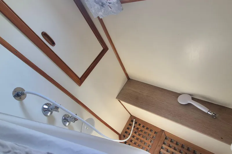 Slide: The Image of Shower area in 1983 Grand Banks 42 Motoryacht with wooden accents and fixtures. - 5