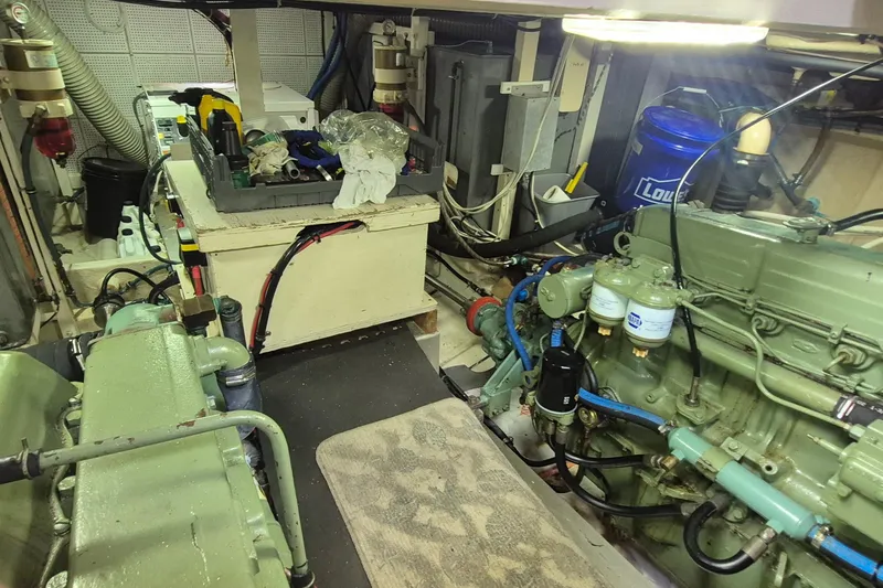 Slide: The Image of Engine room of 1983 Grand Banks 42 Motoryacht with wiring and machinery. - 55