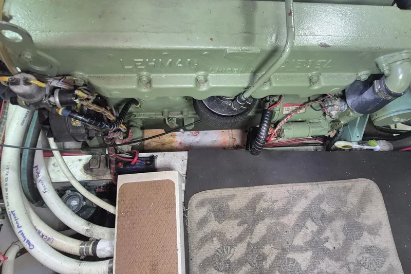 Slide: The Image of Engine room of a 1983 Grand Banks 42 Motoryacht, showcasing a well-maintained marine engine. - 57