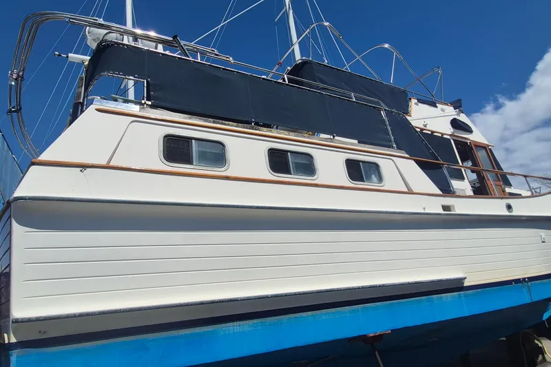 Slide: The Image of 1983 Grand Banks 42 Motoryacht propellers and rudder in dry dock. - 69
