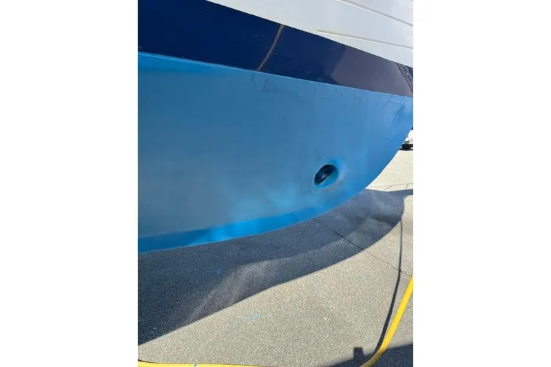 Slide: The Image of Blue hull of 1983 Grand Banks 42 Motoryacht on dry dock. - 80
