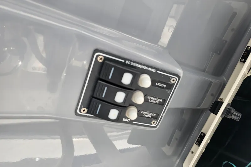 Slide: The Image of Control panel of 2022 NauticStar 28 XS boat with Simrad displays and steering wheel. - 11