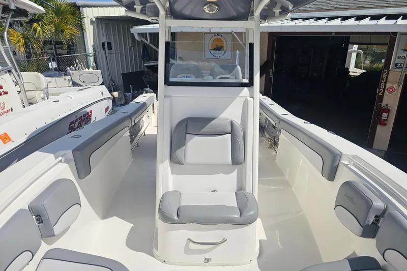 Slide: The Image of Trolling motor on 2022 NauticStar 28 XS boat deck, with coiled cable and fittings. - 15