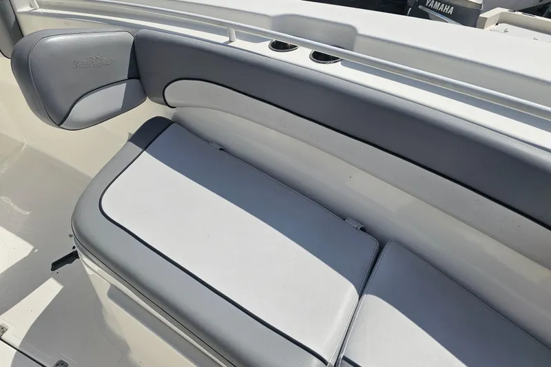 Slide: The Image of 2022 NauticStar 28 XS boat with dual Yamaha 300 V6 engines on a trailer. - 22