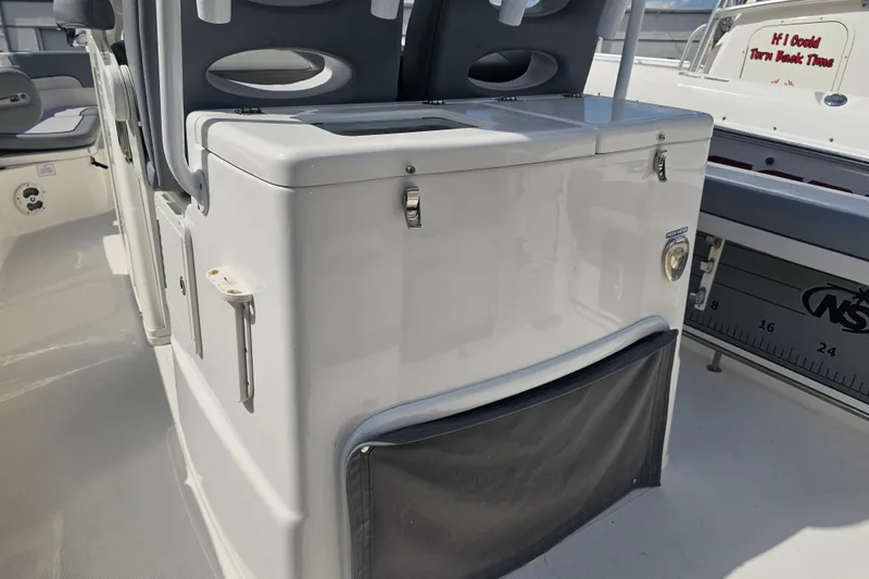 Slide: The Image of Open storage compartment on 2022 NauticStar 28 XS boat, showcasing interior details. - 37