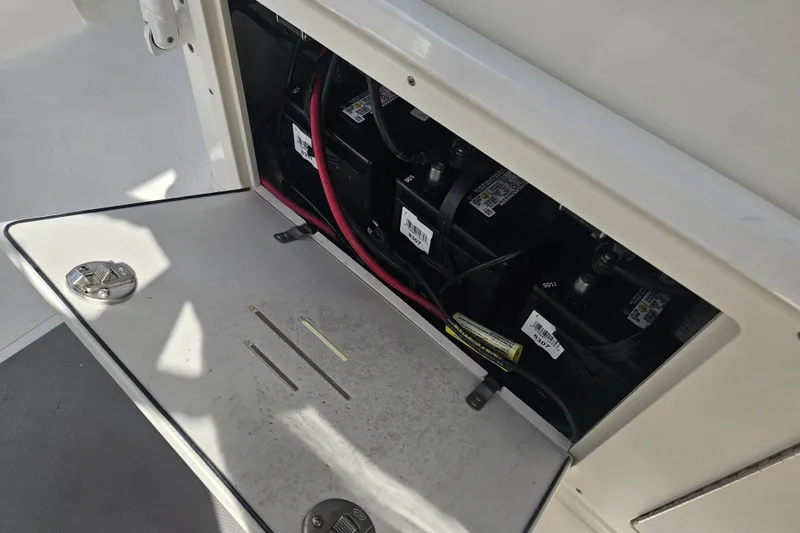 Slide: The Image of 2022 NauticStar 28 XS boat interior with seating and storage compartments. - 39