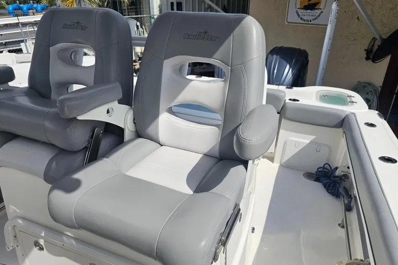 Slide: The Image of Battery compartment of 2022 NauticStar 28 XS boat, showing wiring and connections. - 41