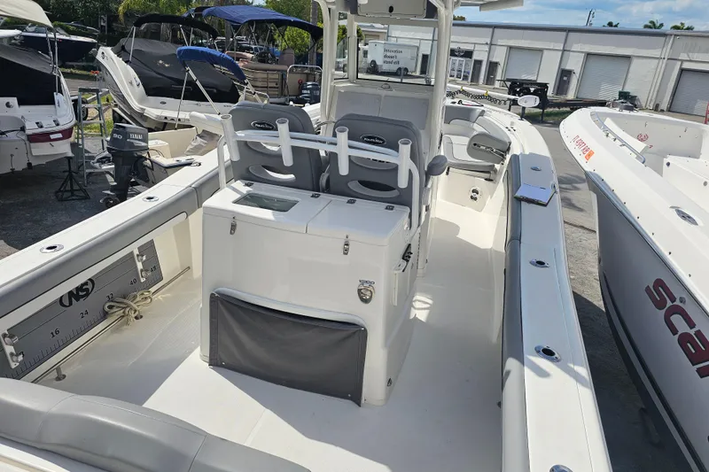 Slide: The Image of Control panel of a 2022 NauticStar 28 XS boat, featuring switches and battery selectors. - 42