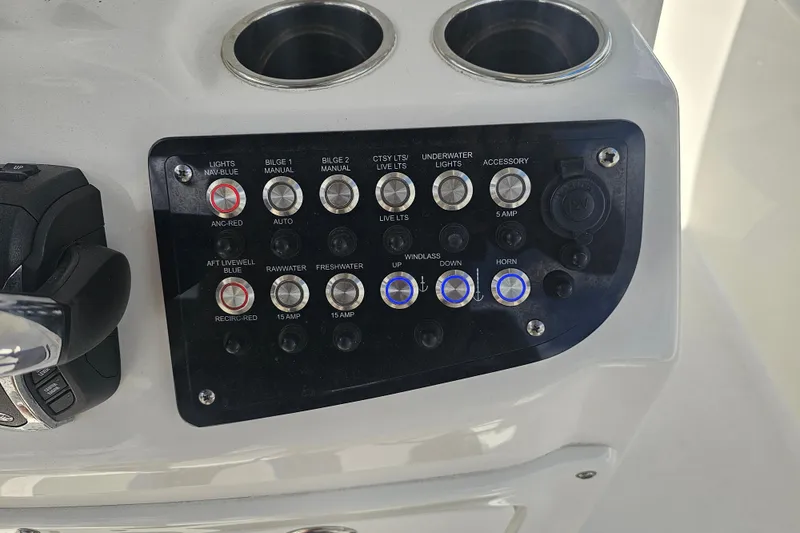 Slide: The Image of 2022 NauticStar 28 XS boat anchor detail with palm trees in background. - 8