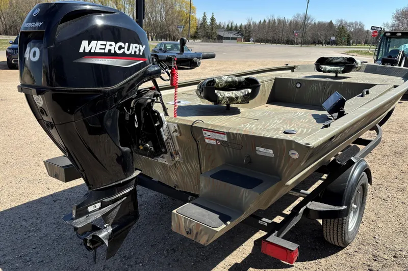 Slide: The Image of 2024 Tracker Grizzly 1654 T Sportsman boat with Mercury 40 engine on trailer. - 10