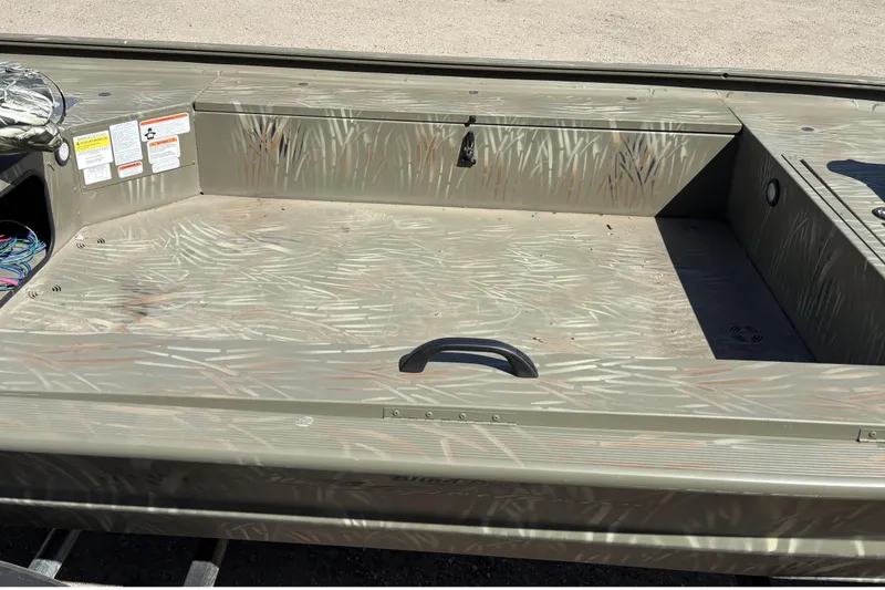Slide: The Image of 2024 Tracker Grizzly 1654 T Sportsman boat interior with camouflage pattern. - 6