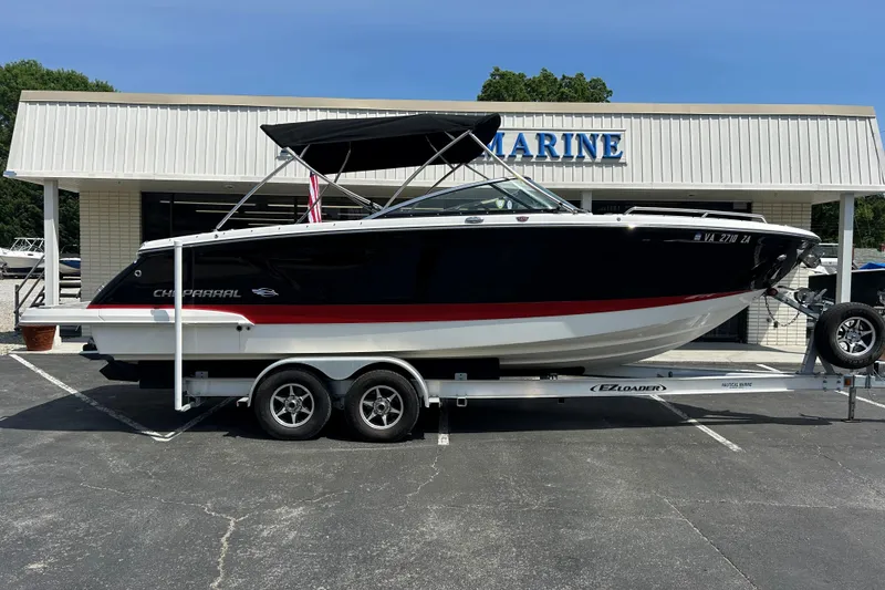The Image of 2018 Chaparral 267 SSX boat on trailer outside marine dealership. - 0