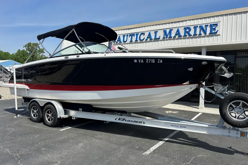 Slide: The Image of 2018 Chaparral 267 SSX boat on trailer outside Nautical Marine dealership. - 1