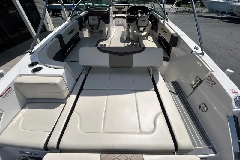 Slide: The Image of 2018 Chaparral 267 SSX boat interior with spacious seating and modern design. - 10