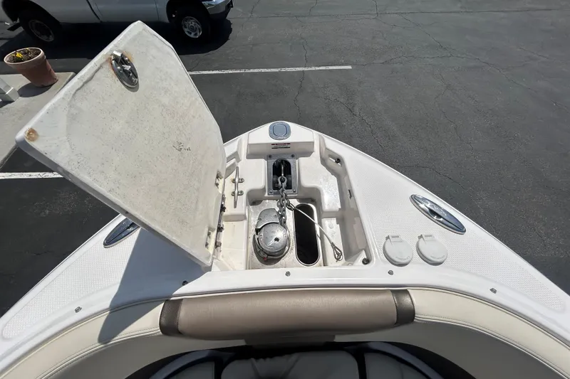 Slide: The Image of Bow storage compartment of 2018 Chaparral 267 SSX boat, open to reveal anchor and chain. - 12