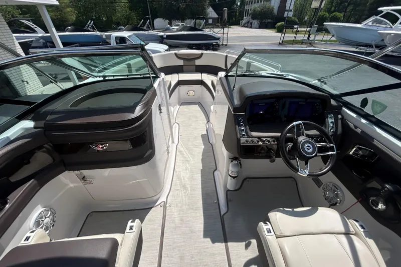 Slide: The Image of 2018 Chaparral 267 SSX boat interior with modern dashboard and seating. - 15