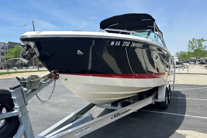 Slide: The Image of 2018 Chaparral 267 SSX boat on trailer, black and white with red stripe. - 3