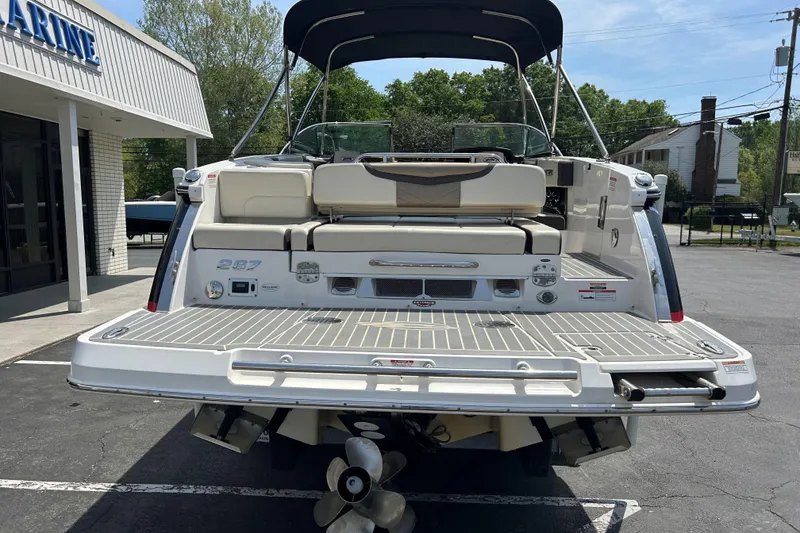 Slide: The Image of 2018 Chaparral 267 SSX boat rear view, showcasing spacious deck and seating. - 5