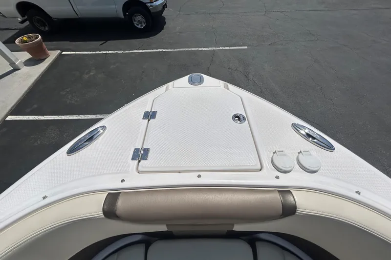 Slide: The Image of Bow view of 2018 Chaparral 267 SSX boat in a parking lot. - 9
