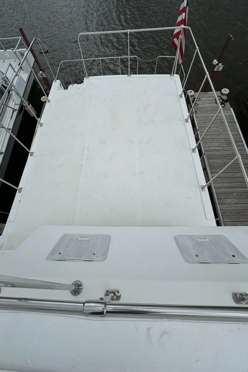 Slide: The Image of 2008 Holiday Mansion 37 boat deck with railing and American flag. - 12