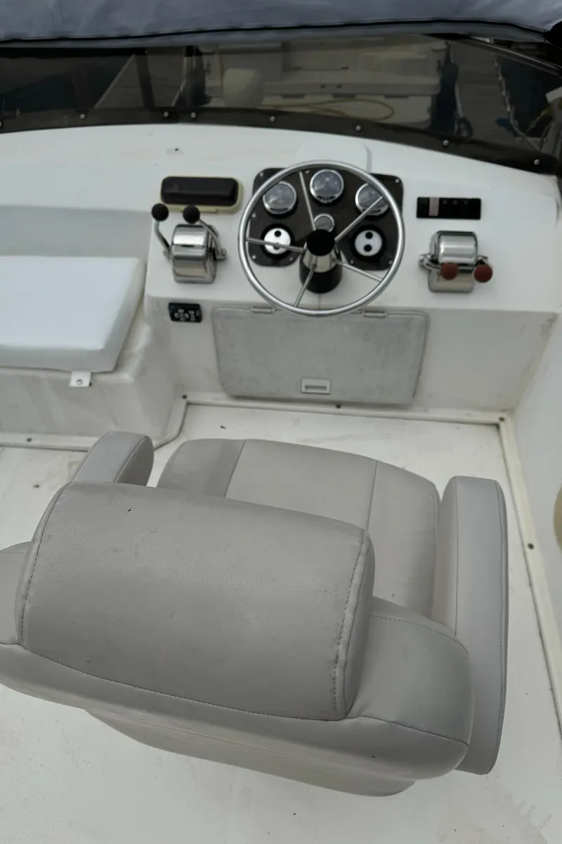 Slide: The Image of Steering area of a 2008 Holiday Mansion 37 boat with controls and seating. - 13