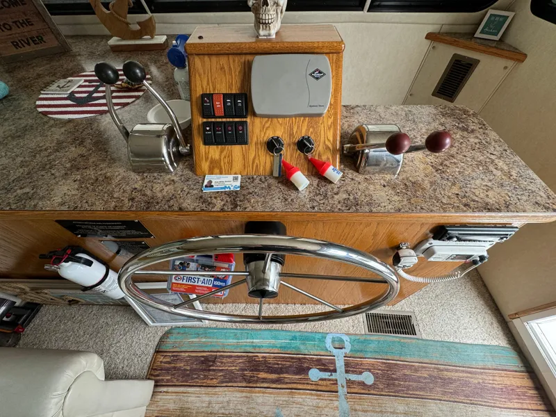 Slide: The Image of Pilothouse of 2008 Holiday Mansion 37 with steering wheel and control panel. - 15